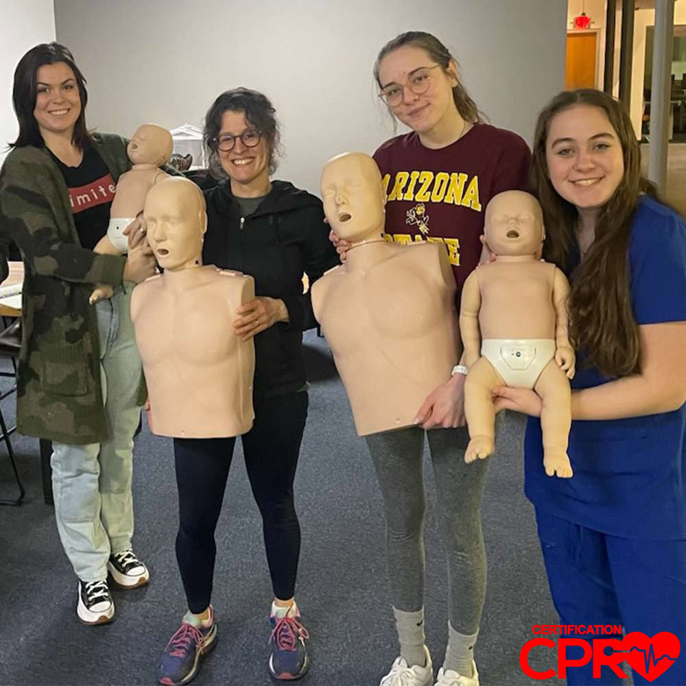 Students practicing CPR on manikins during a Lakeland certification class.