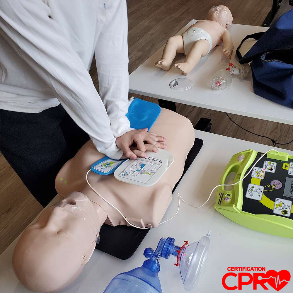 CPR training with mannequin and AED for certification in Lakeland.