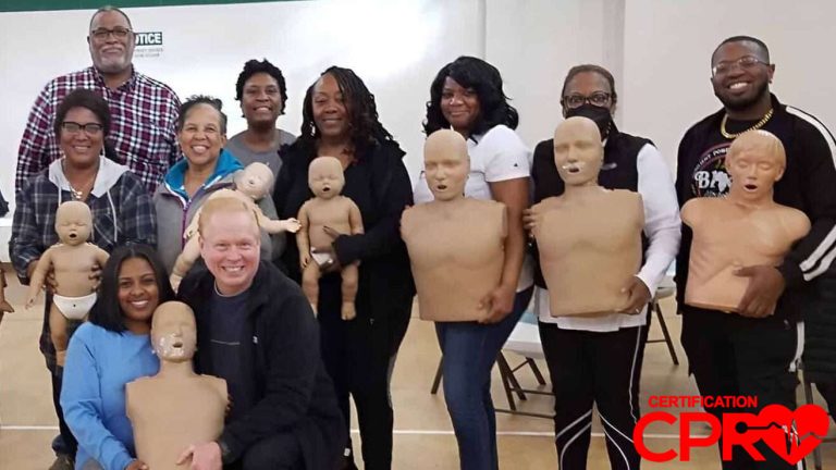 Group CPR training session in Lakeland with mannequins for certification.