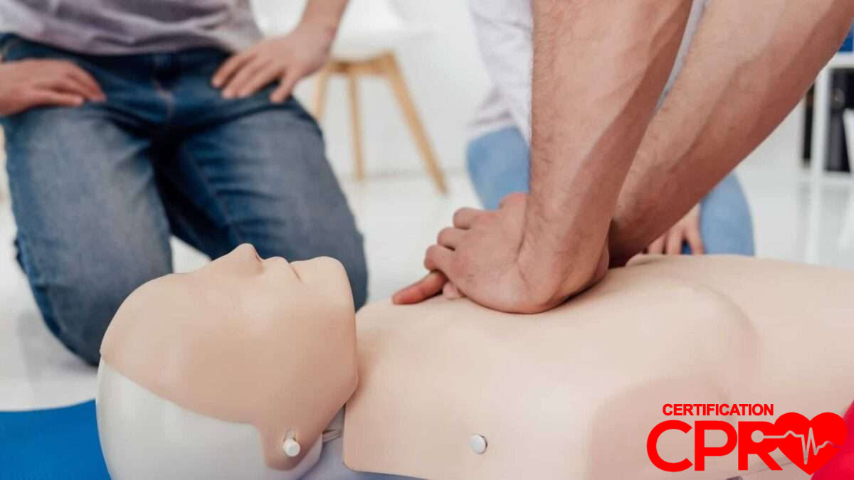 CPR training session with a man practicing on a mannequin in Lakeland.